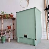 Old chest of drawers with two green drawers