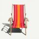 Vintage deck chair with red and orange striped fabric, original patina.