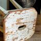 Workshop stool in antique patinated solid wood