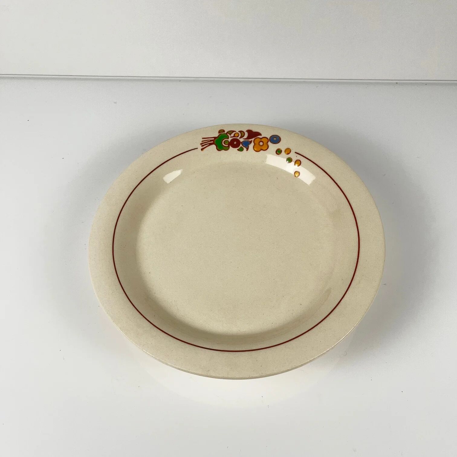 Presentation plate with pedestal Longwy, early 20th century, floral decoration.