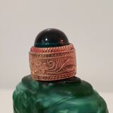 Glass bottle of malachite