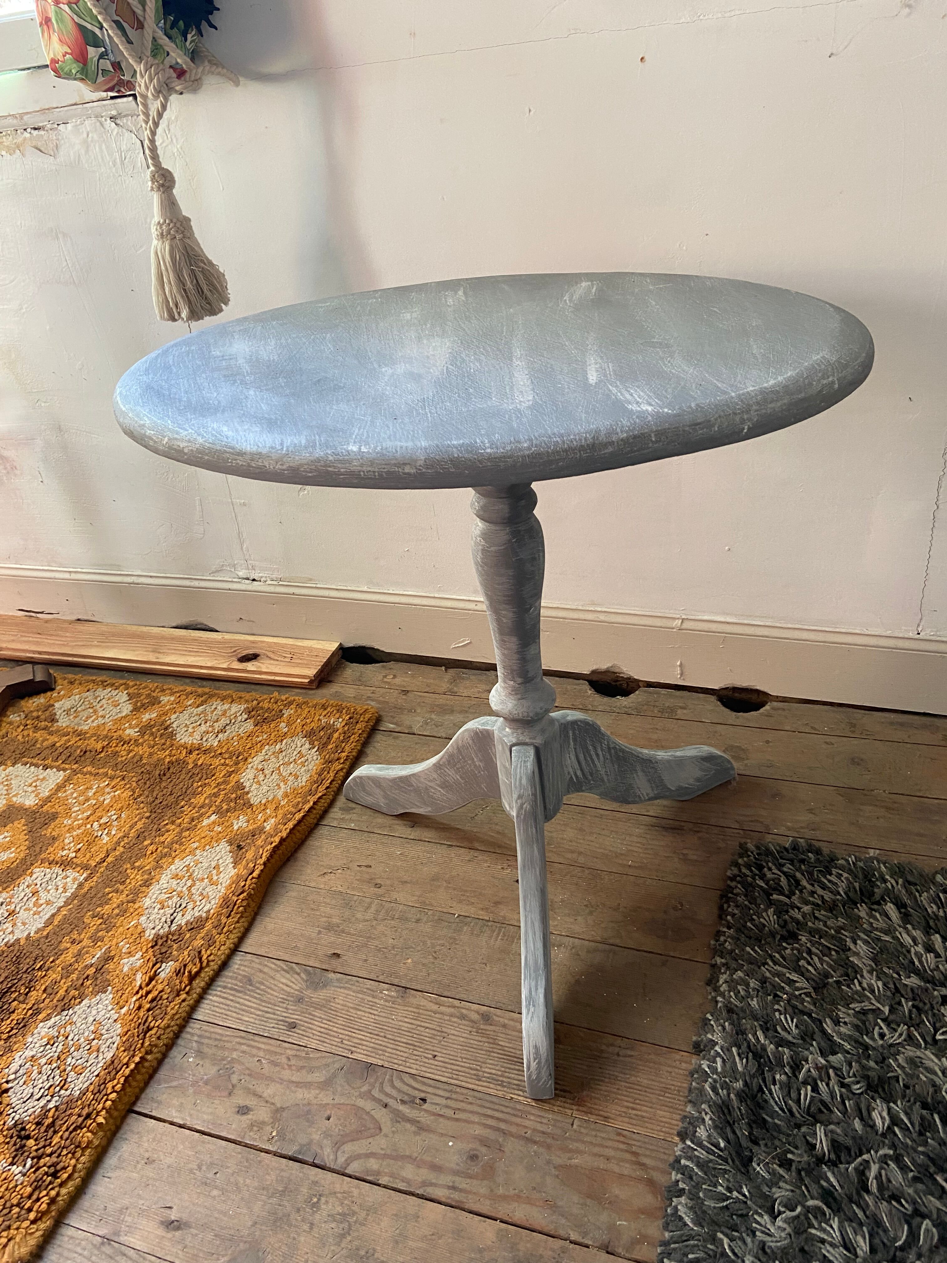 Patinated wooden pedestal table
