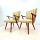 A pair vintage cocktail chairs with stripes and metal screws