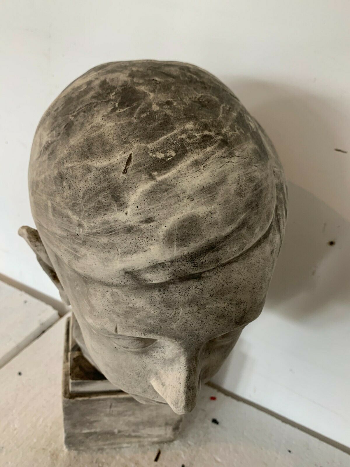 Bust of a young man in plaster signed Gerard Choain XX century