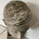 Bust of a young man in plaster signed Gerard Choain XX century