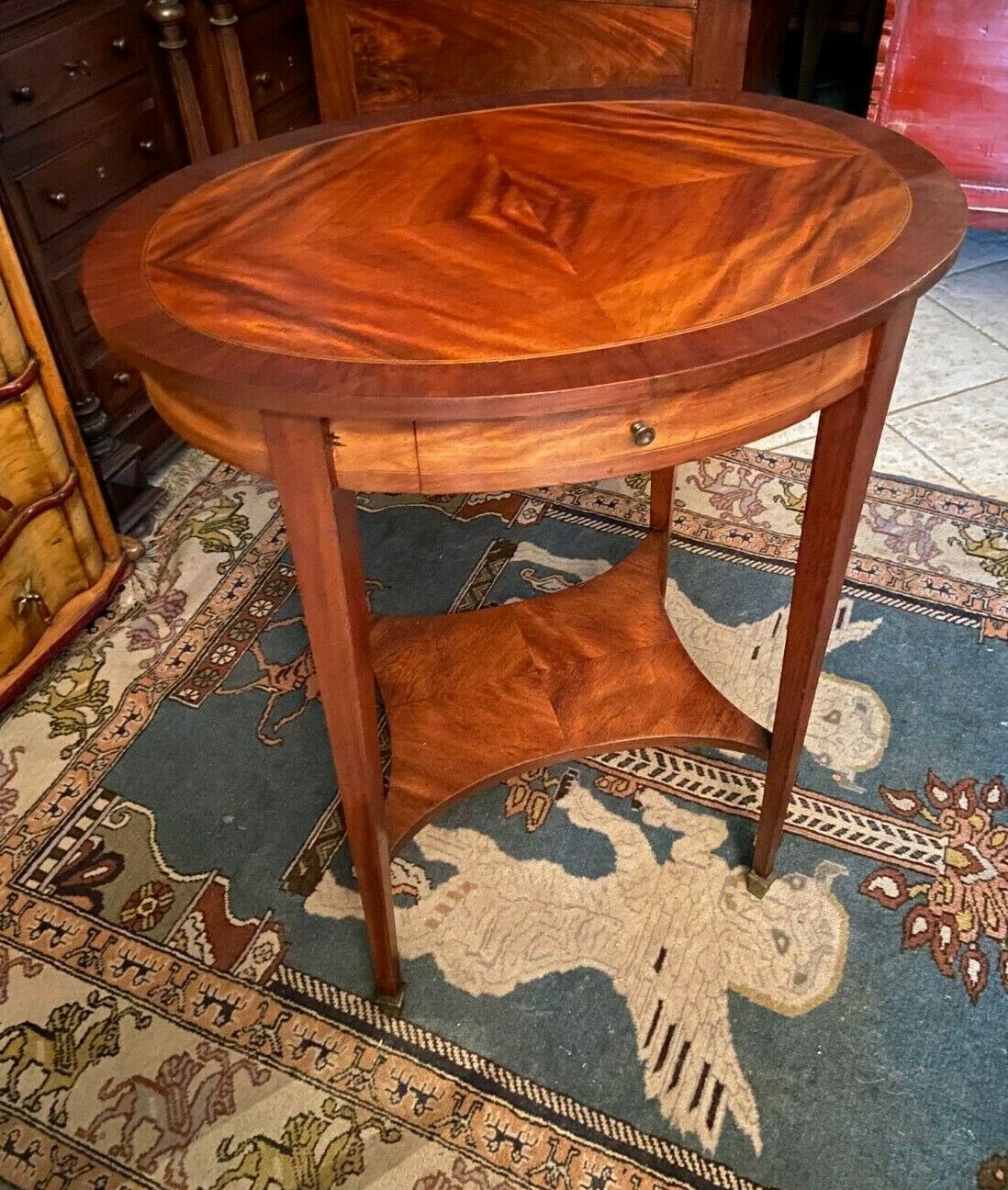 Oval pedestal table with a drawer and a tablet decorated inlaid Louis XVI style