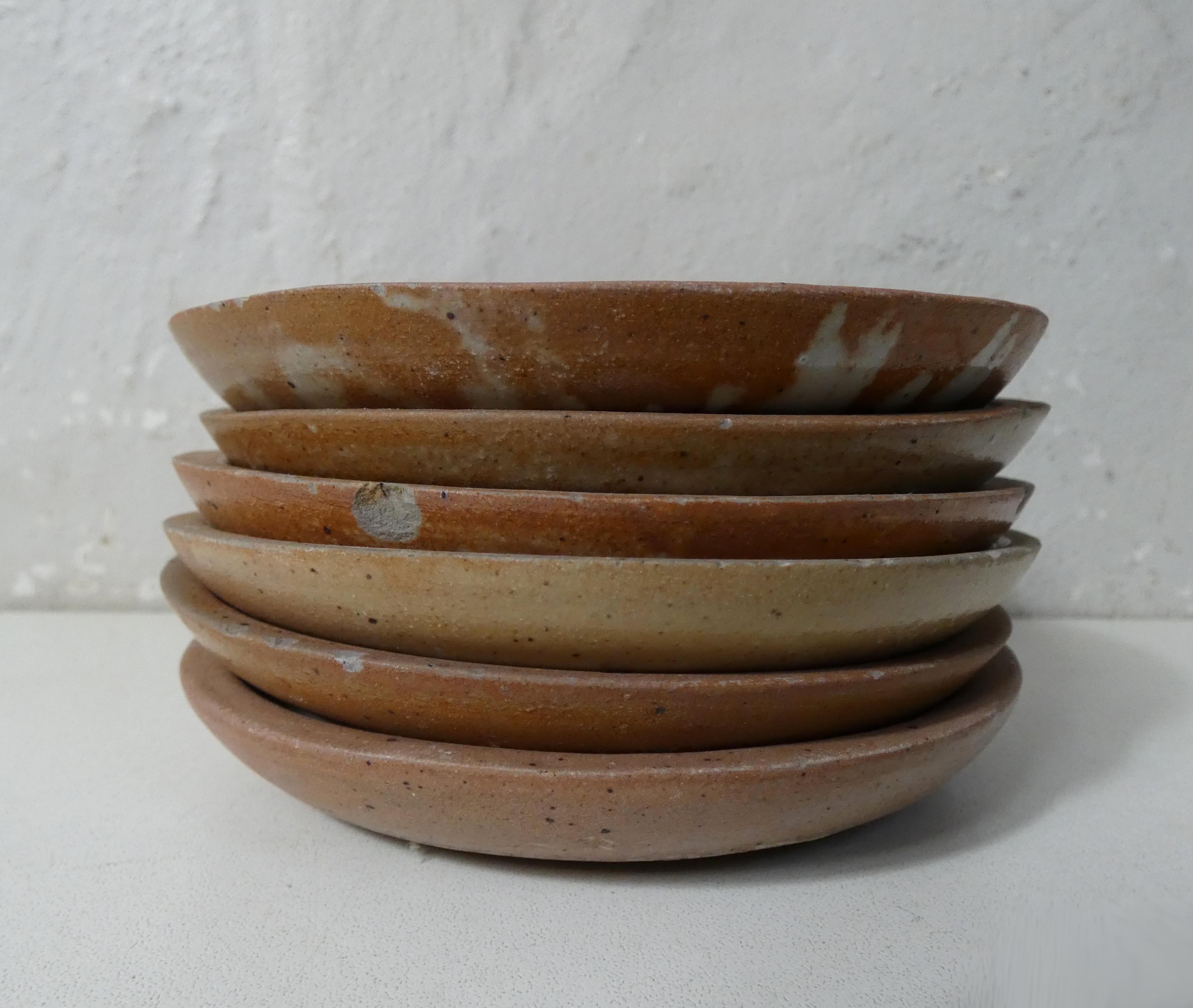 6 stoneware cups and saucers