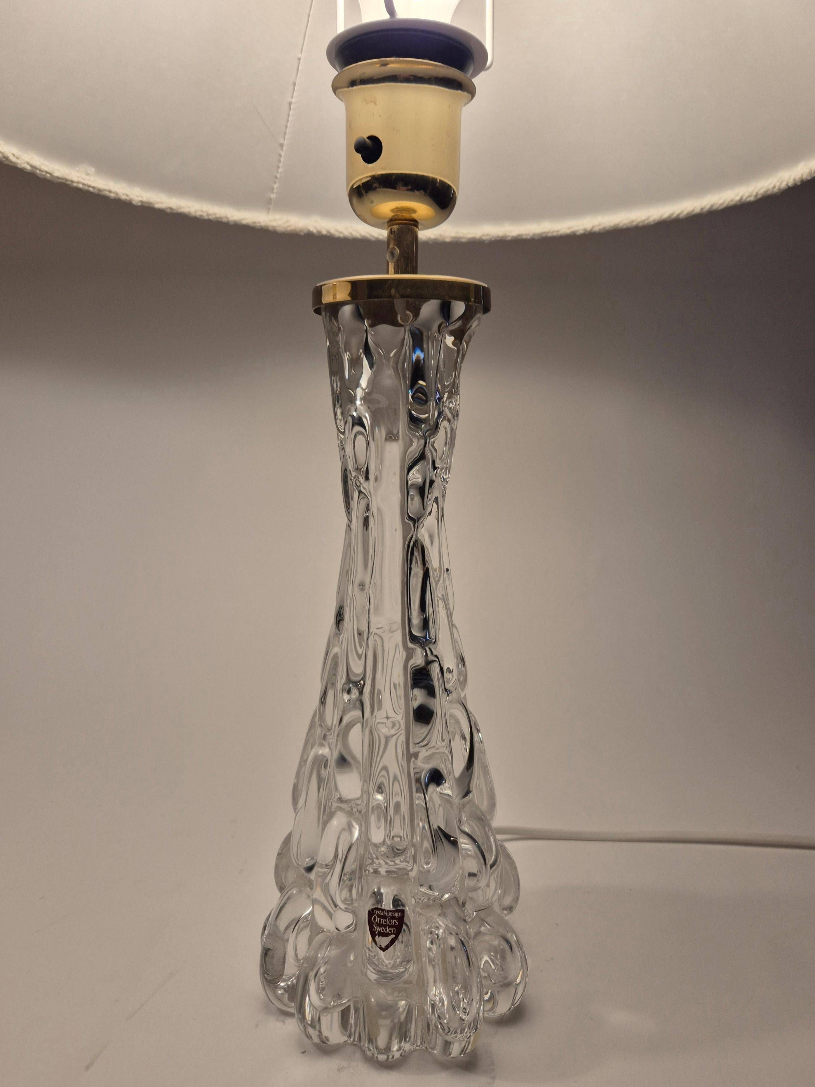 Elegant pair of table lamps The Modern Scandinavian Modern with Orrefors glass and brass.