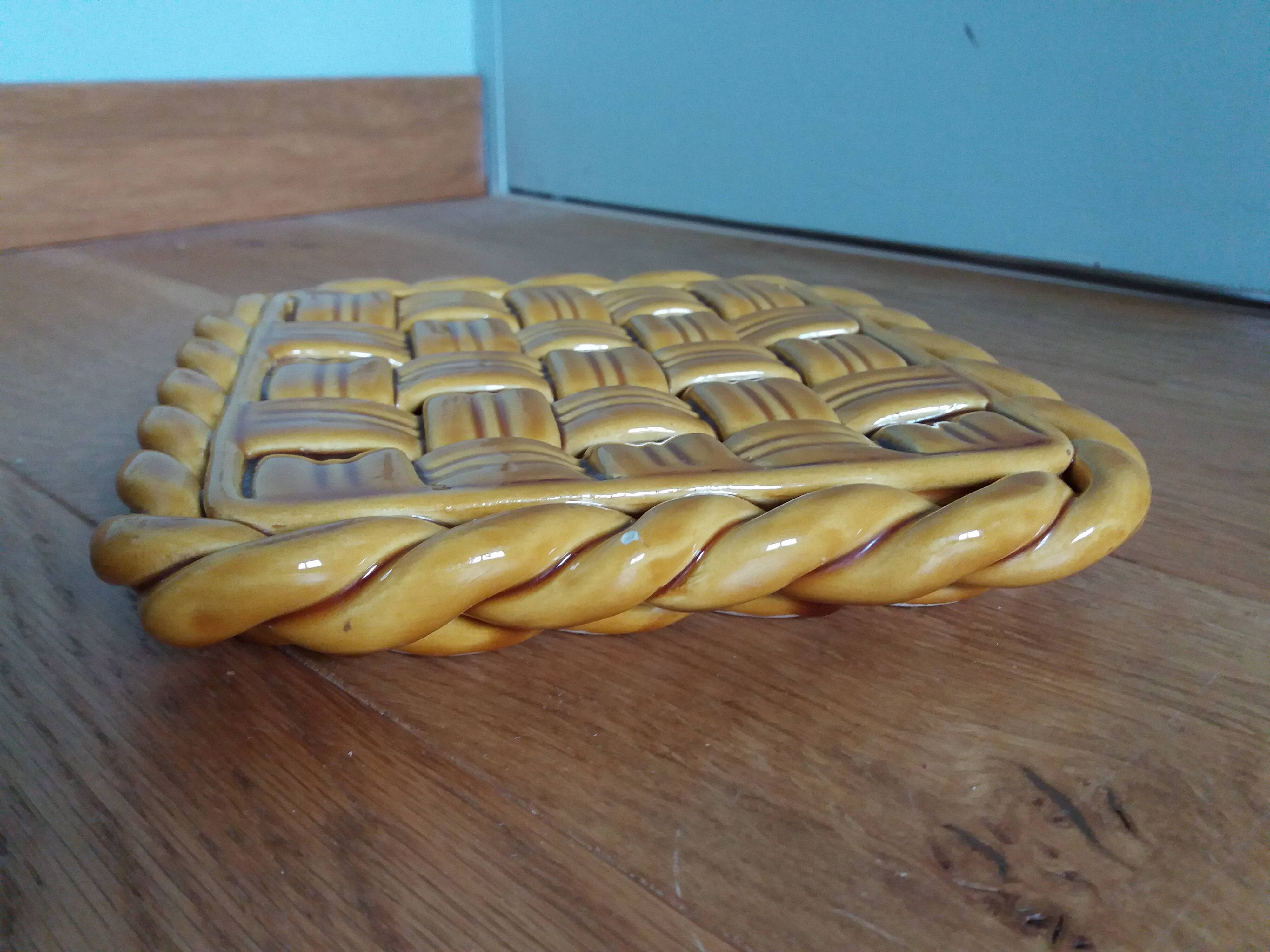 Openwork woven ceramic trivet