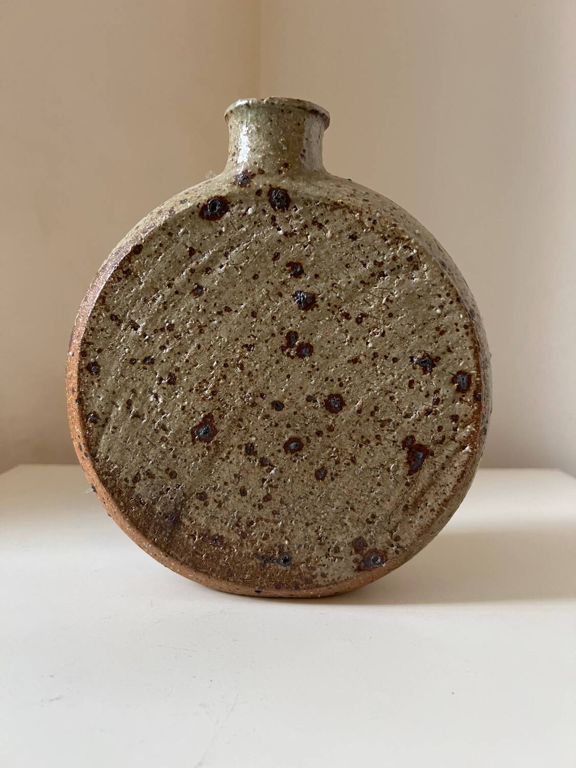 Vintage round, flat-bottomed stoneware bud vase