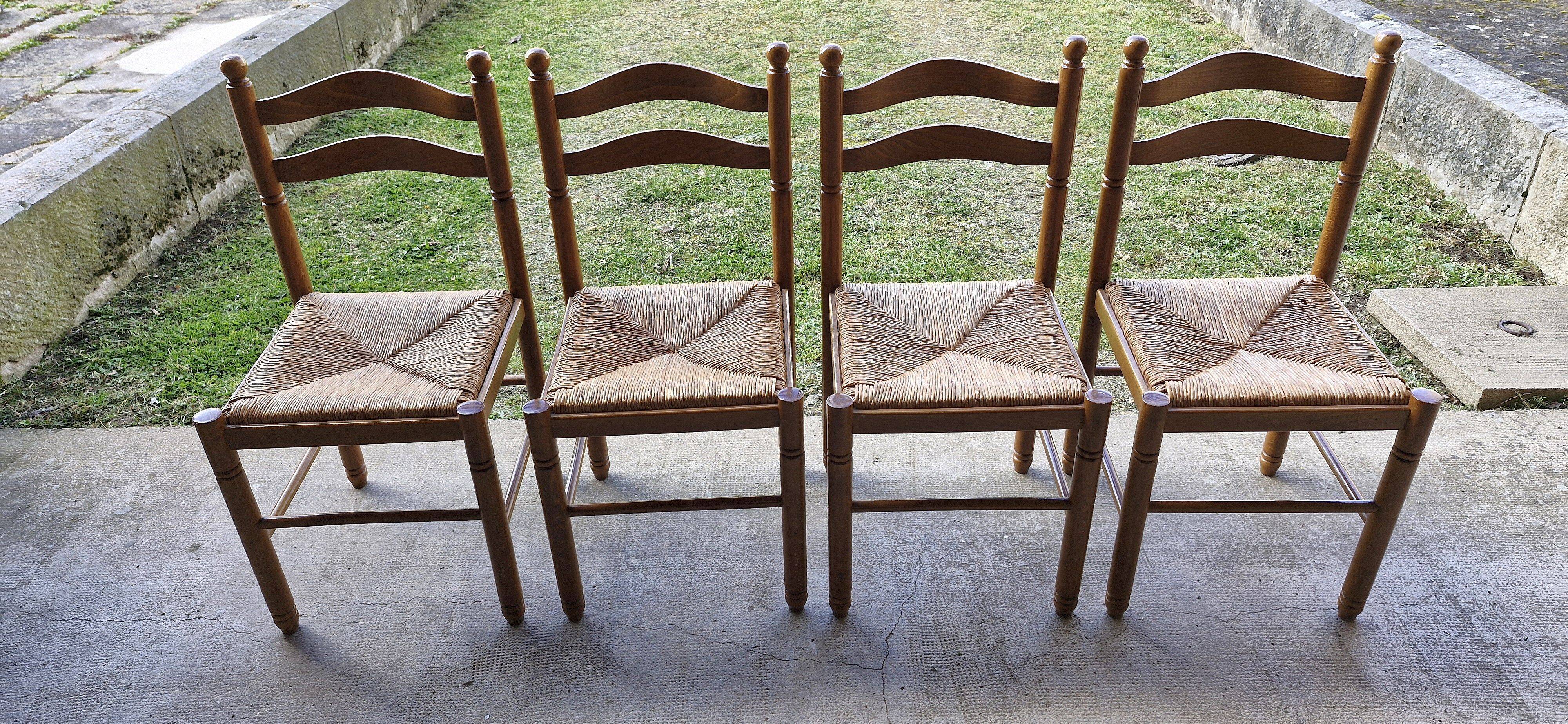 Wooden table with 2 extensions + 4 wooden chairs with rush seats