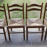 Wooden table with 2 extensions + 4 wooden chairs with rush seats