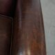 Dark brown sheepskin armchair finished with decorative nails