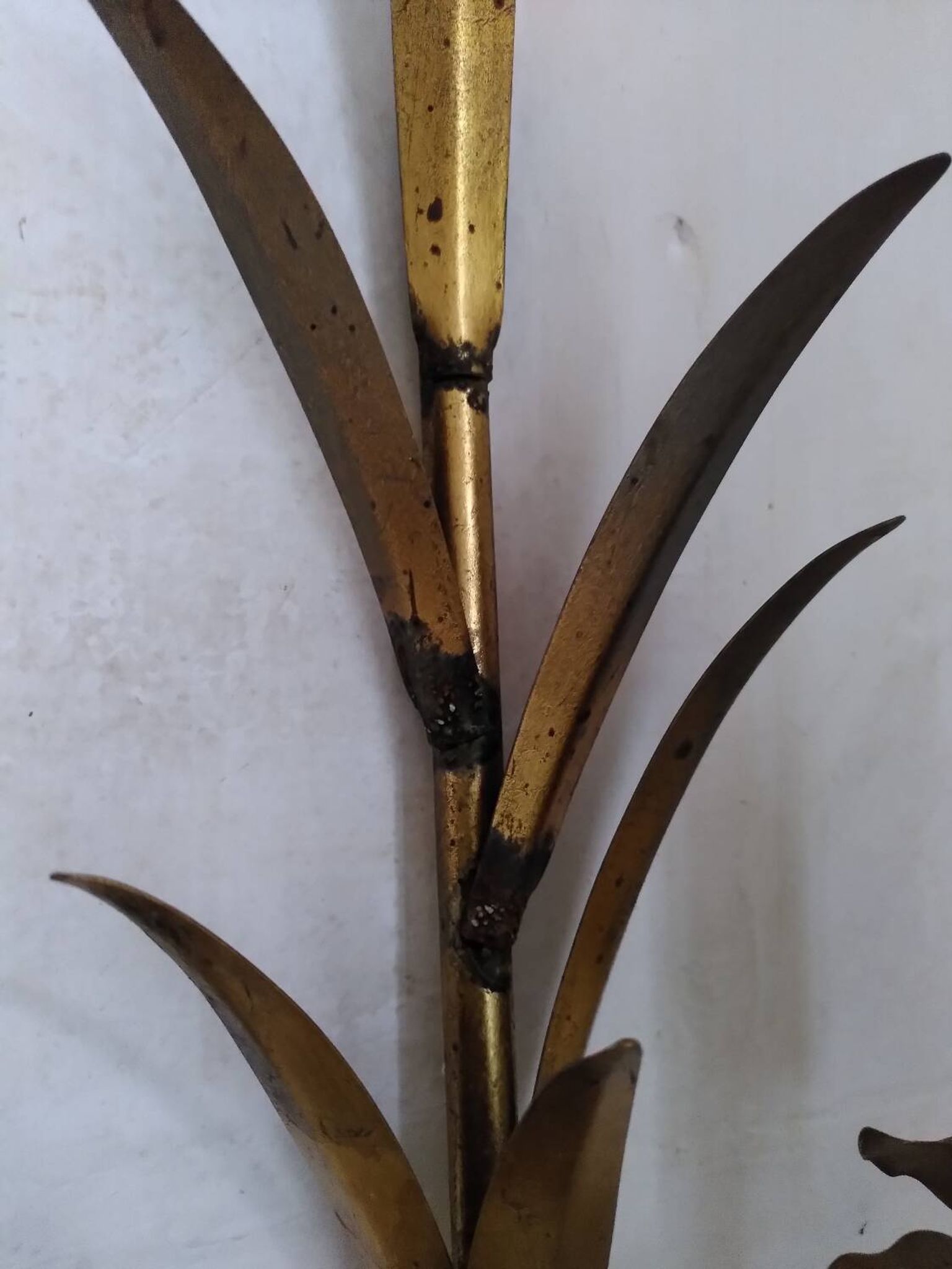 Pair of gold metal leaf wall sconces