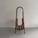 Mid-century black metal and wicker magazine rack, 1960, Germany