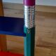 wooden wall shelf multicolor pencils Pierre Sala