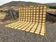 Very large Moroccan Berber rug in ecru and camel 400x300 cm with a grid pattern.