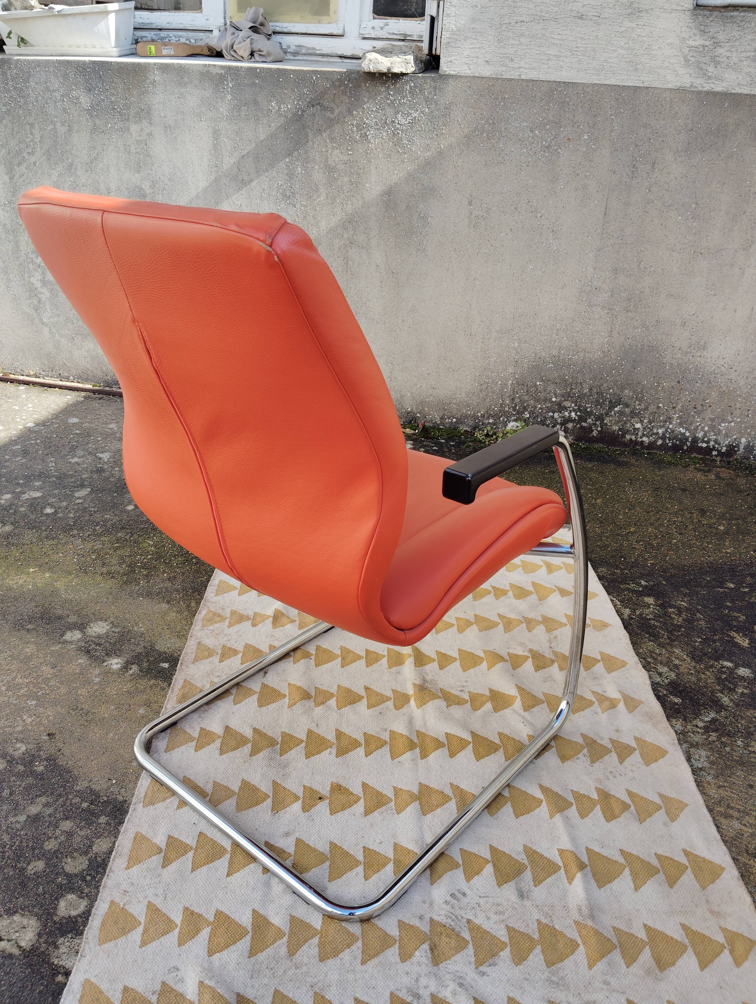Orange leather cantilever tubular armchair