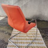 Orange leather cantilever tubular armchair