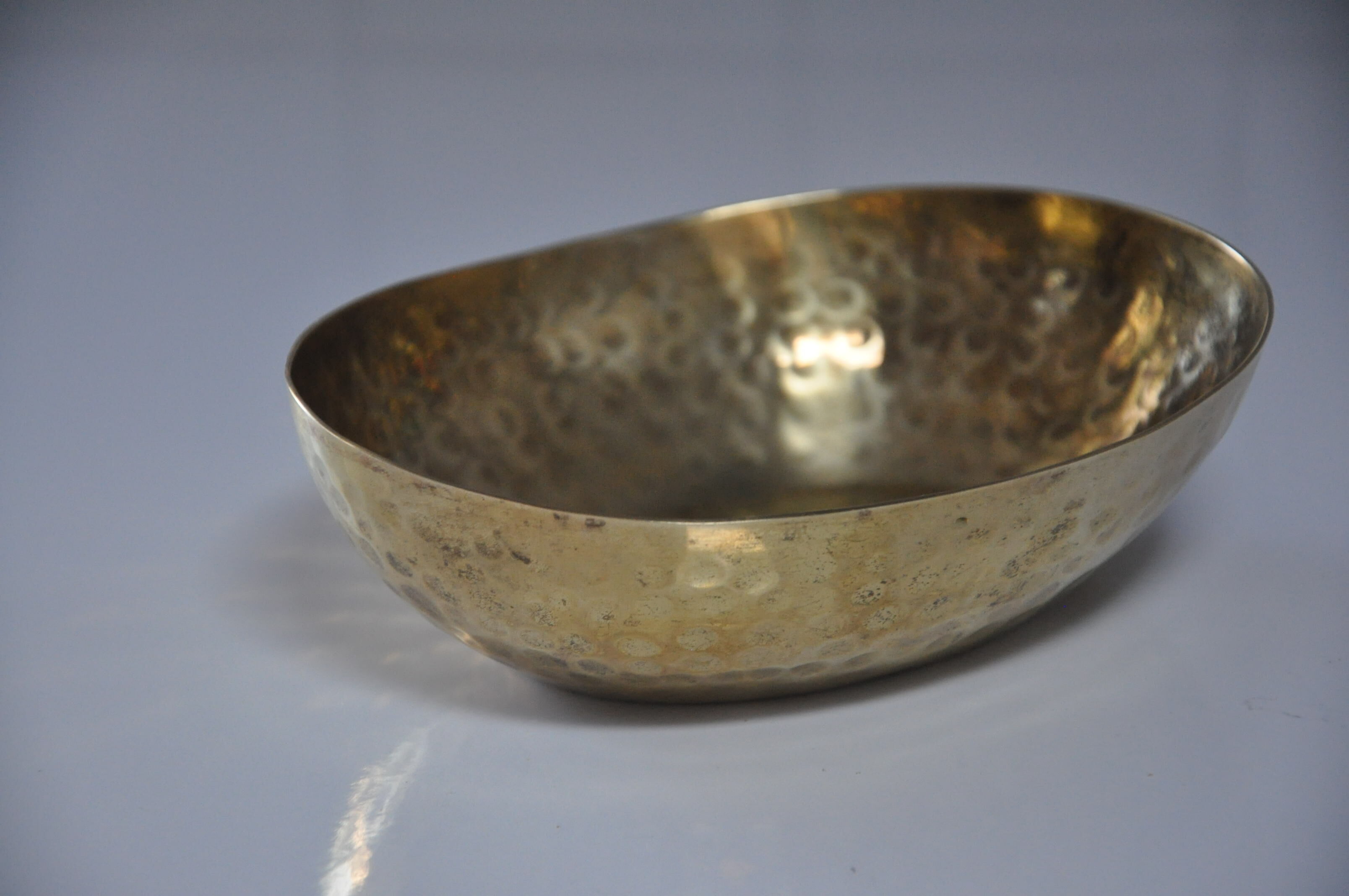 Empty hammered brass pocket