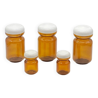 Series of vintage amber glass jars