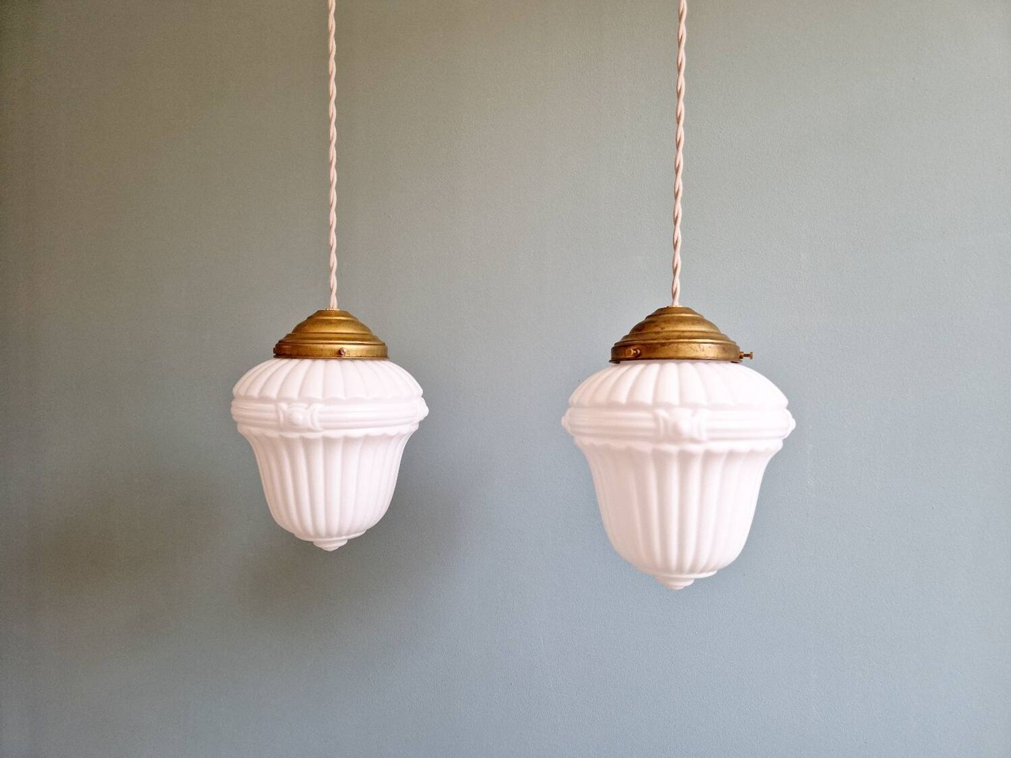 Pair of Art Deco pendant lights in pressed white opaline glass, 1920-30