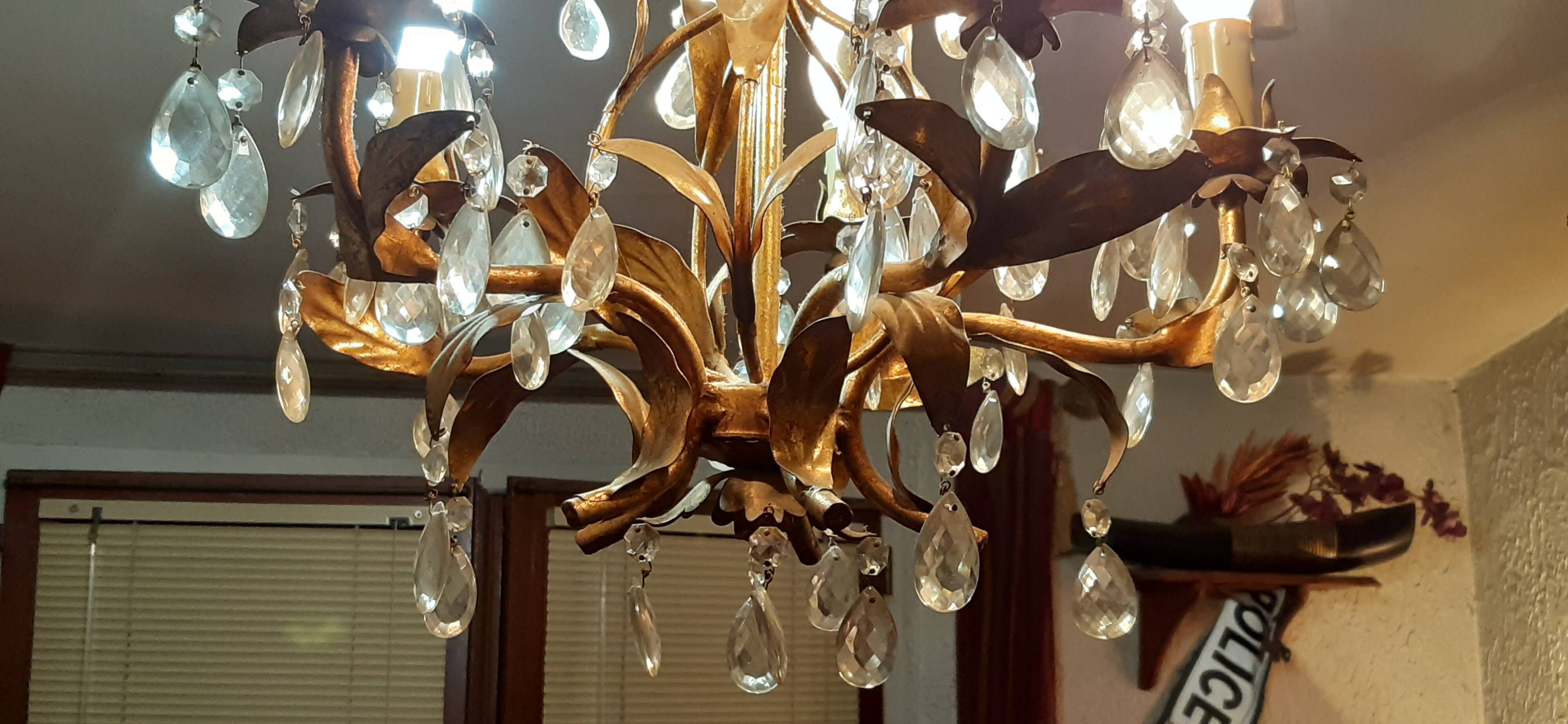Very pretty chandelier with tassels and leaves in gold sheet metal.