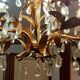 Very pretty chandelier with tassels and leaves in gold sheet metal.