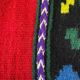 Romanian wool rug, red background with delicate colourful flowers