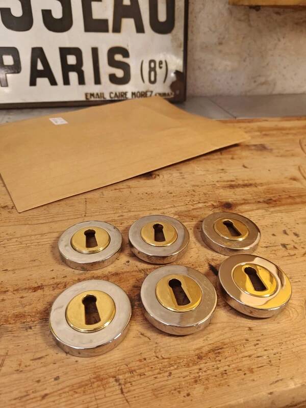 Rare vintage metal door lock fittings in gold and silver.
