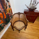 Cane seat armchair from the 19th century in the Louis XV style, known as "couillard".
