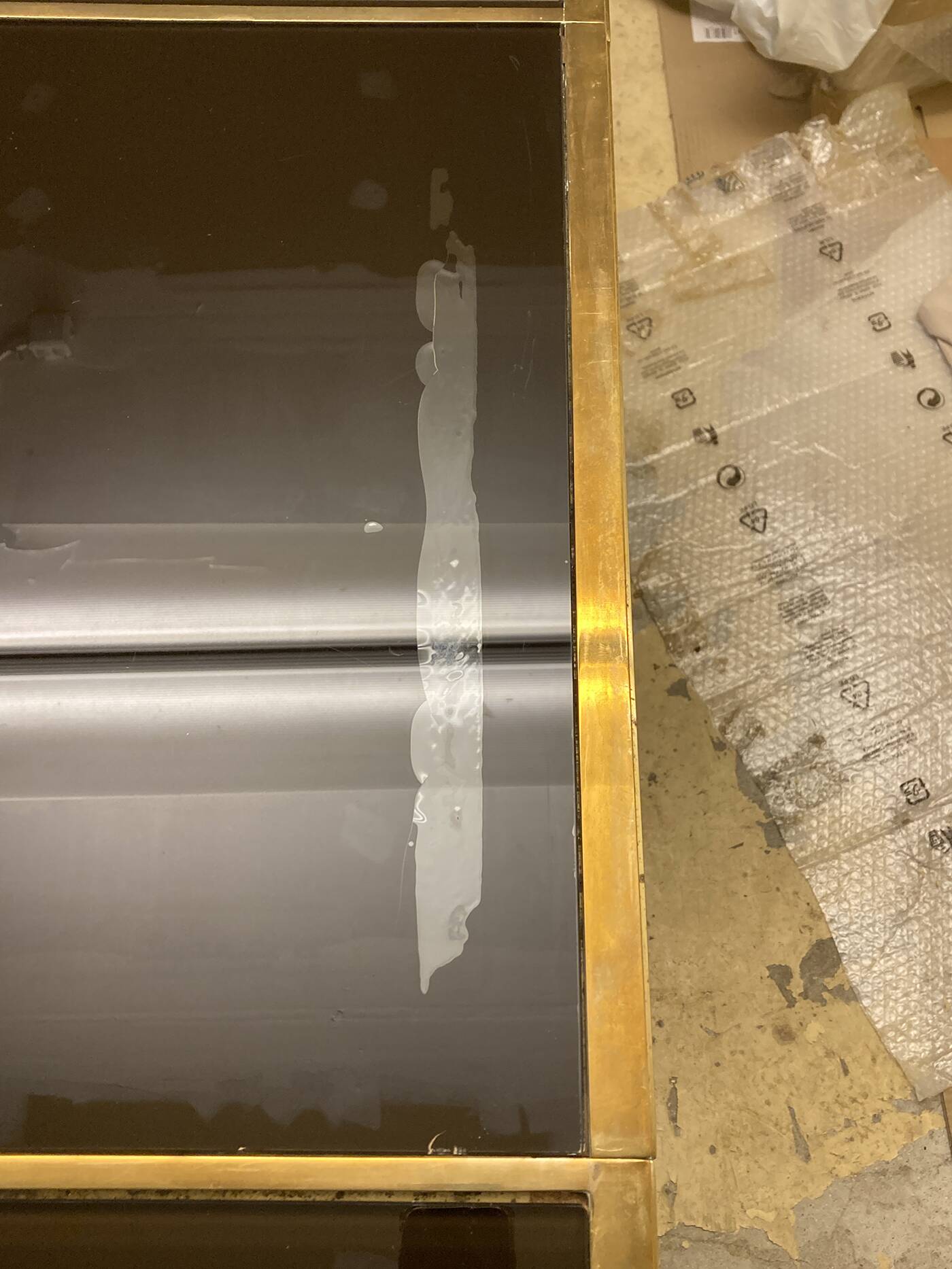 Coffee table in solid brass and black opaline. 1970