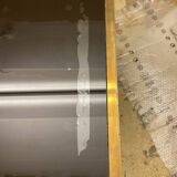 Coffee table in solid brass and black opaline. 1970