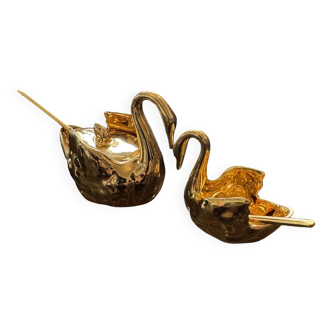 Pair of golden salt cellars in Limoges porcelain shaped like swans
