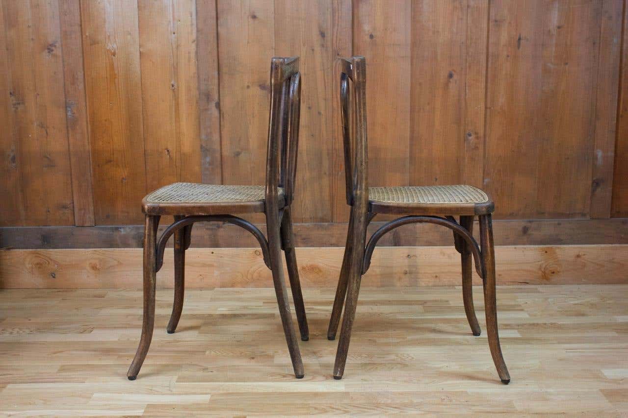 Pair of wooden bistro chairs, 20th century, France