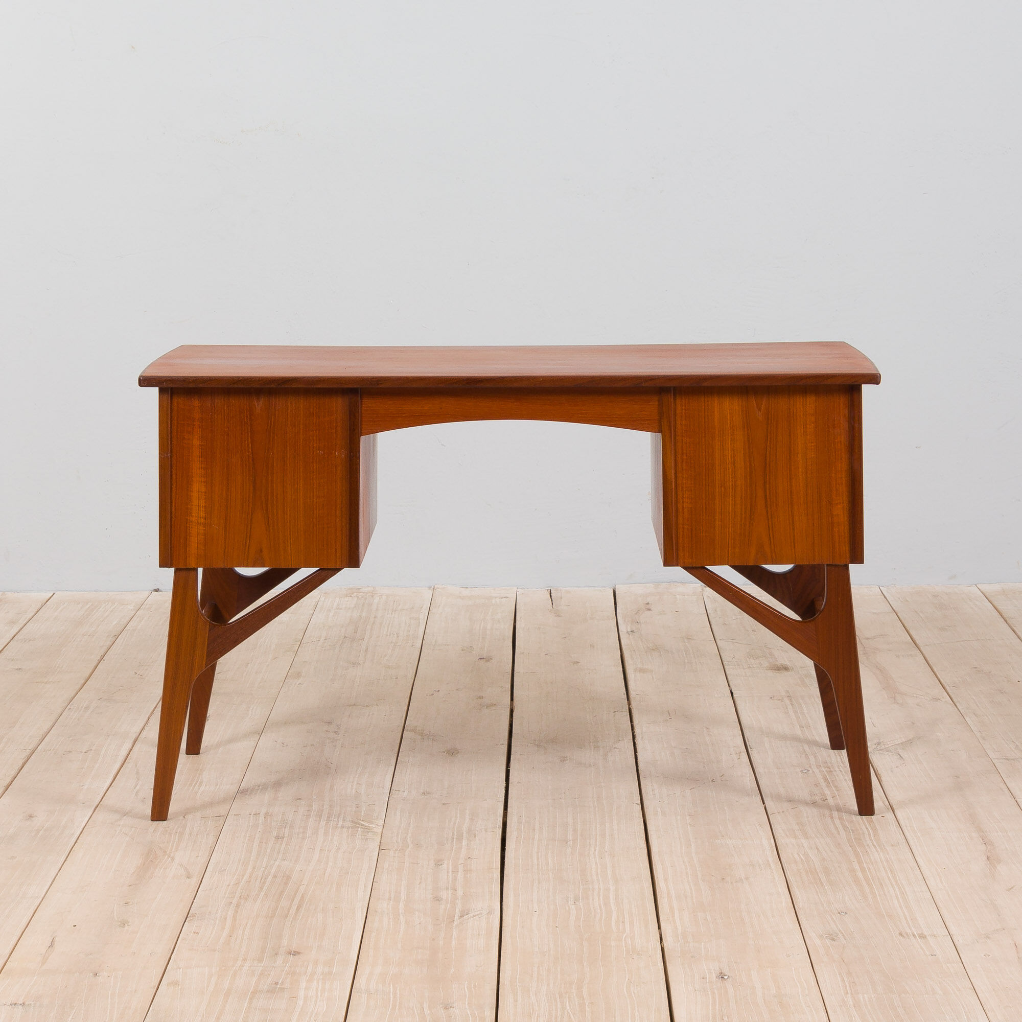 Danish mid century teak desk on sculptural base, 1960s.