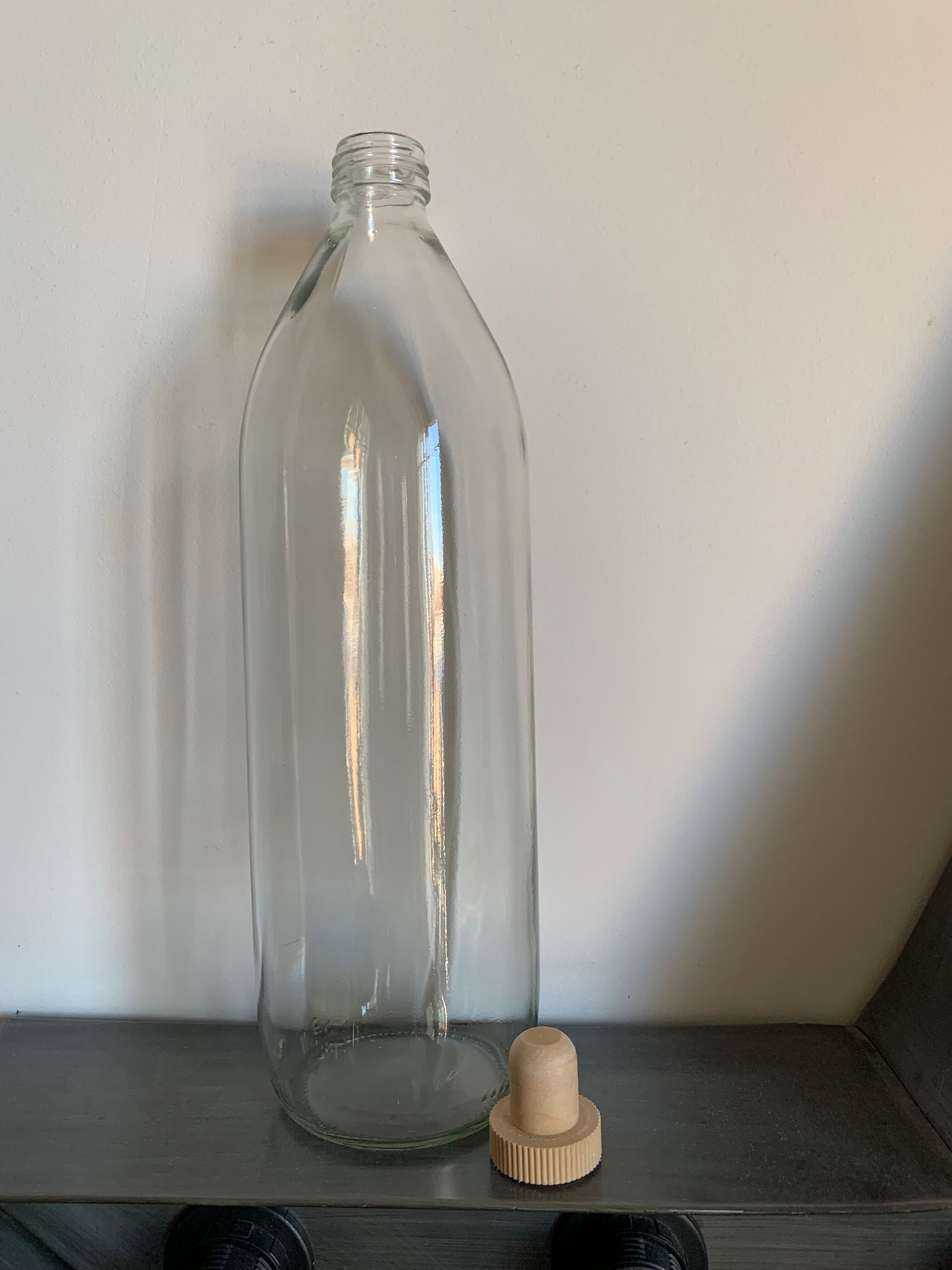 Antique glass bottle with a capacity of 1 litre and its beige cap - in very good condition!
