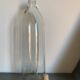 Antique glass bottle with a capacity of 1 litre and its beige cap - in very good condition!