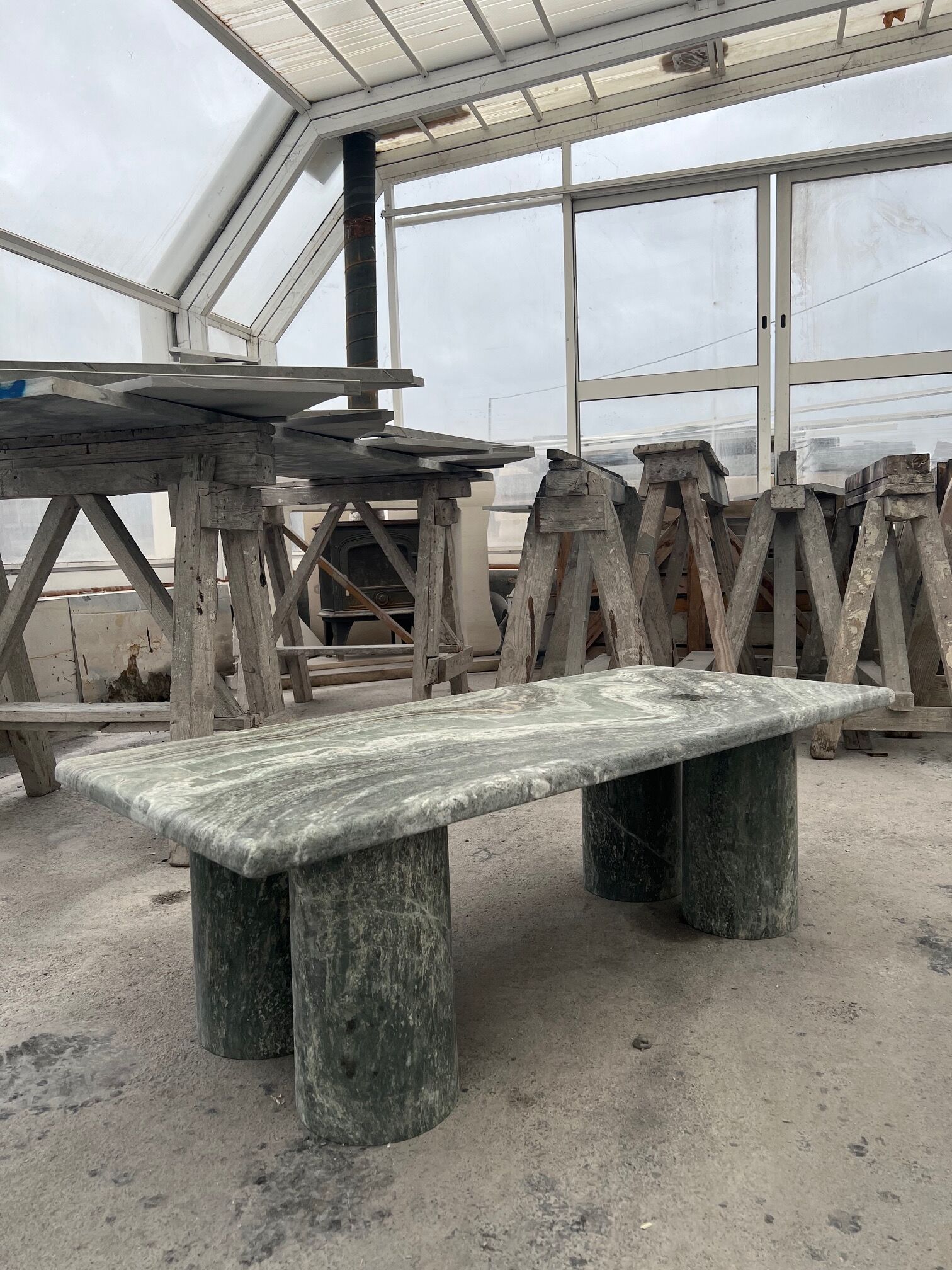 Green marble coffee table with cylindrical legs