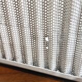 White perforated sheet metal planter by Mathieu Mategot