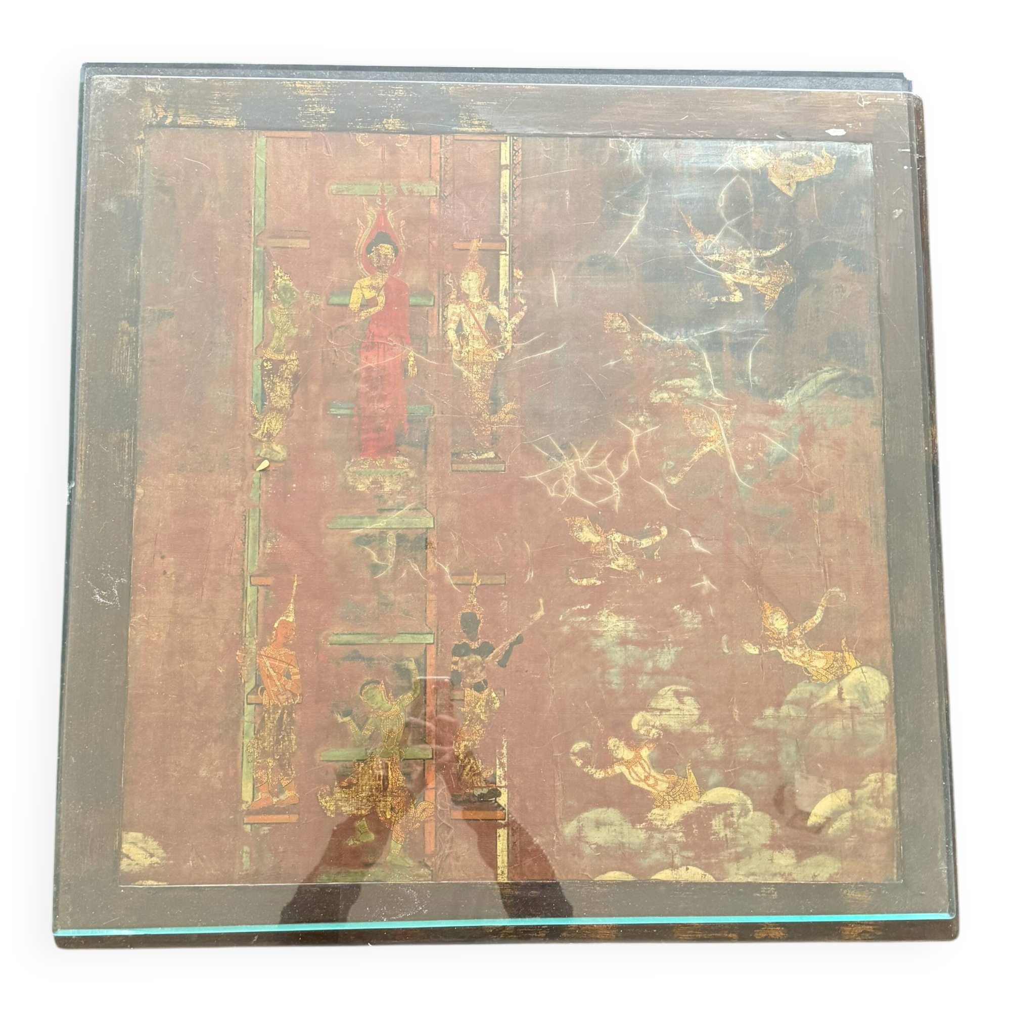 Vintage brutalist coffee table with Asian decor.