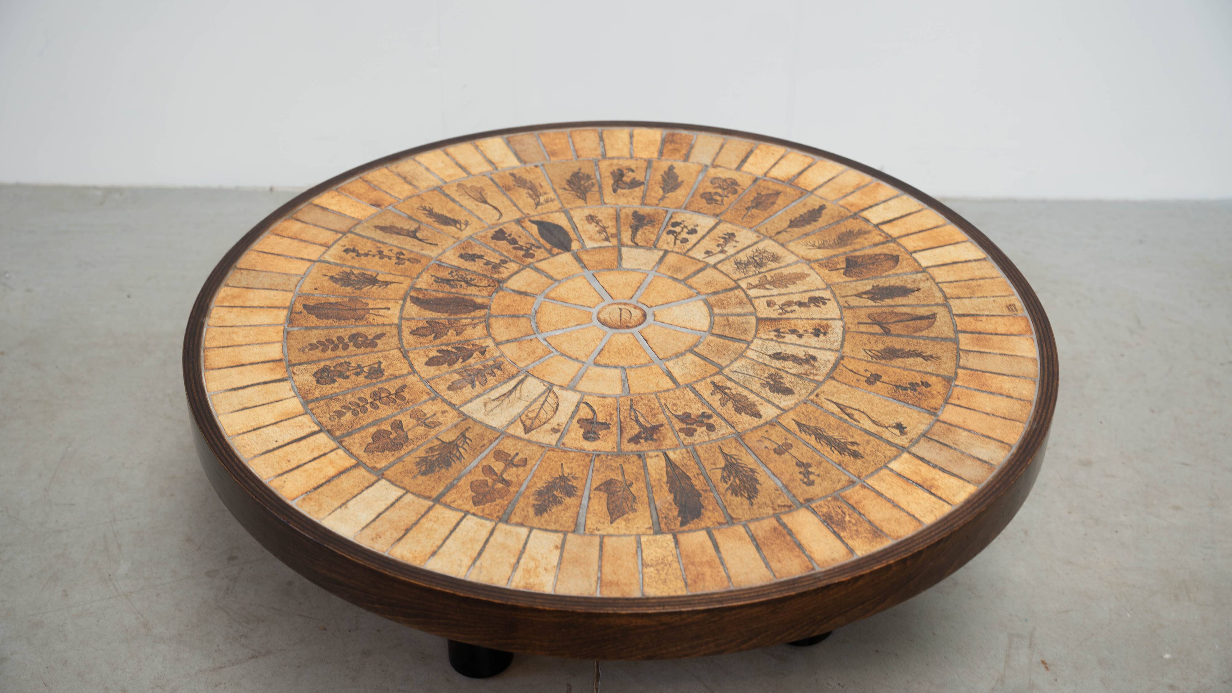 Round coffee table by Roger Capron