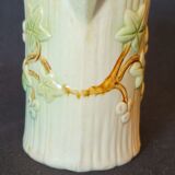 Old pitcher in slip 1900 ivy or holly decoration