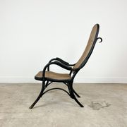 Antique black bentwood and cane lounge armchair by Thonet 19th century