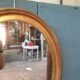 Pair of golden oval mirrors