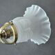 Brass gooseneck wall lamp and tulip lampshade
