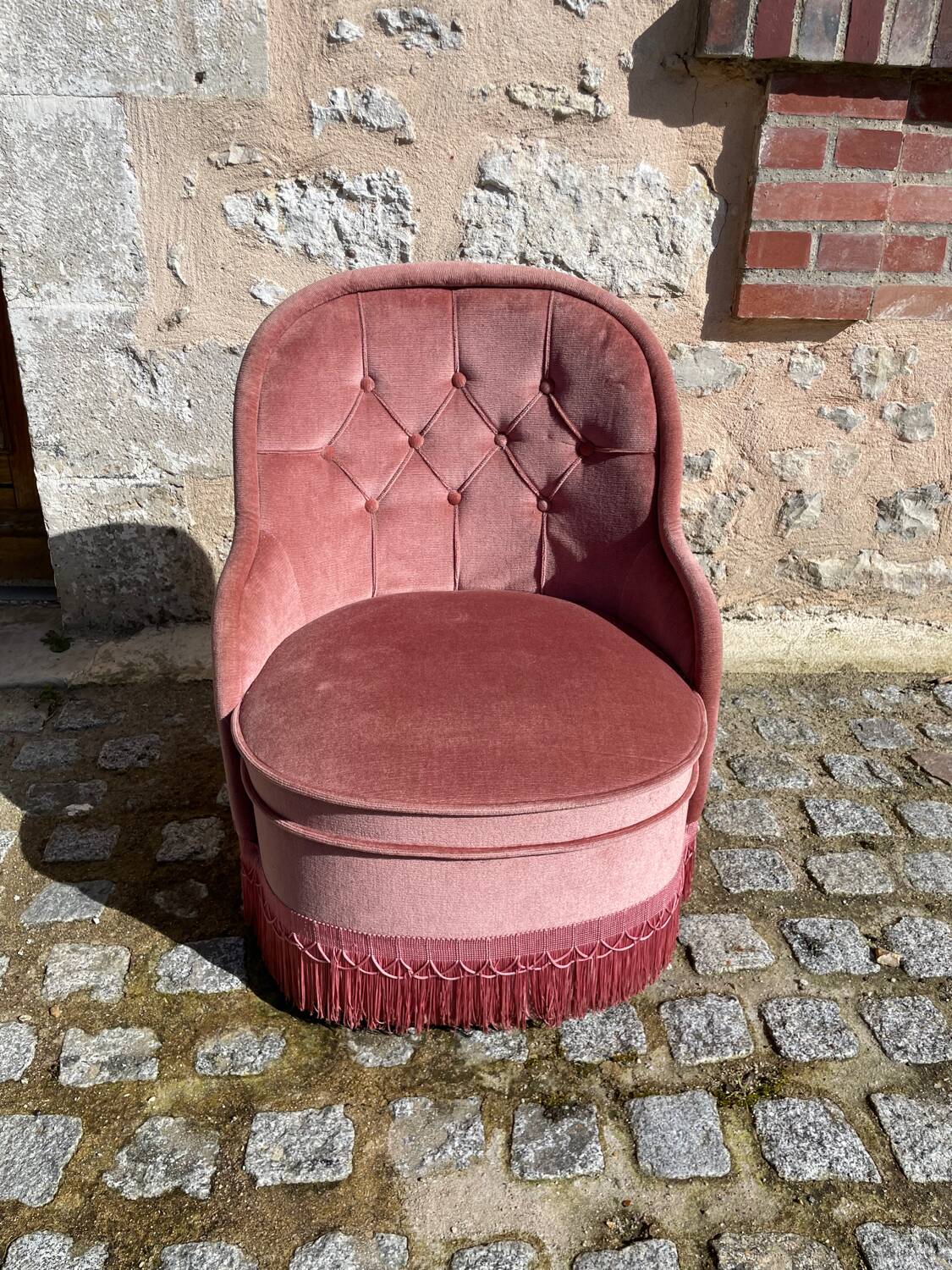 Pink velvet armchair