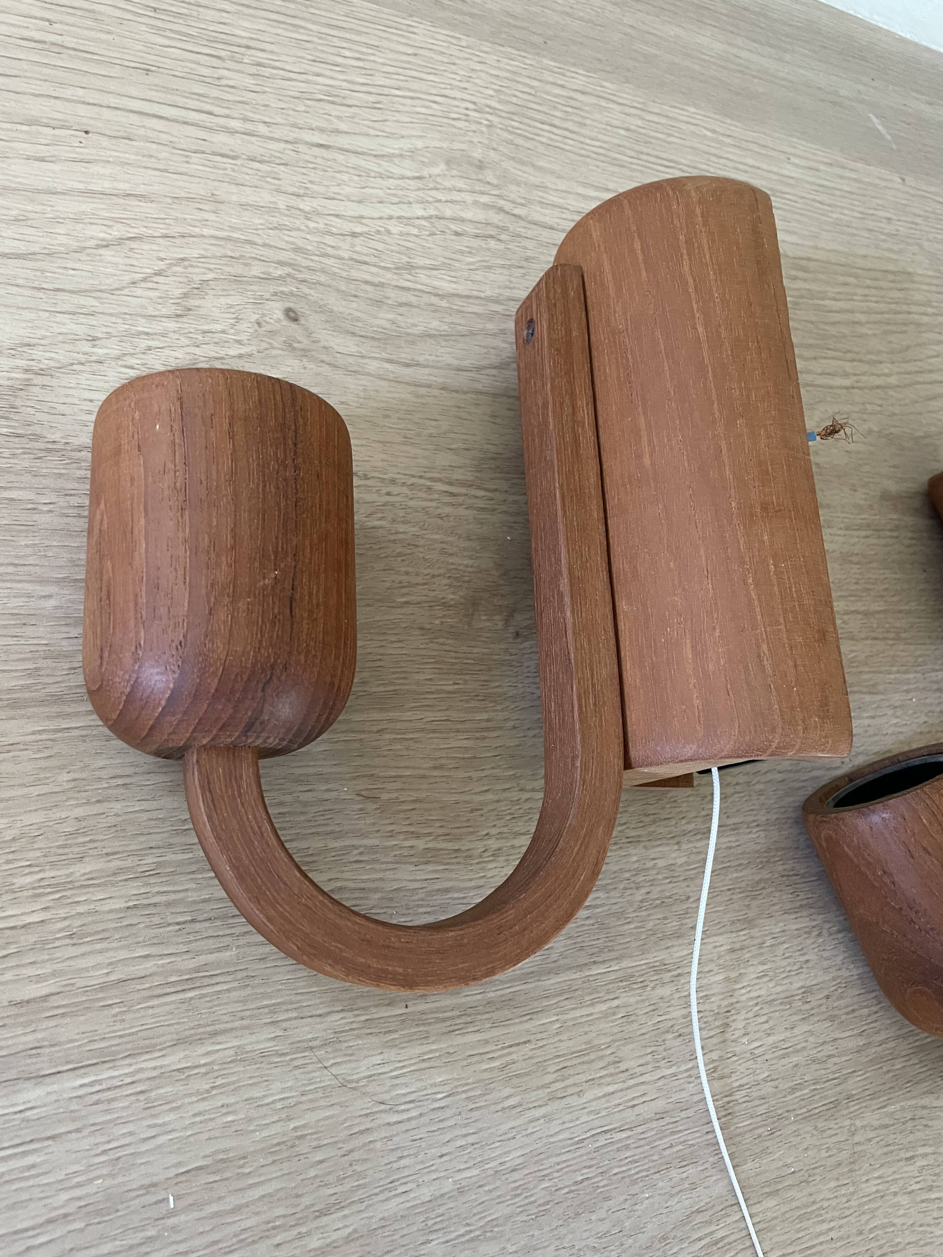 Pair of Scandinavian teak wall lights, Dolmus, 70s