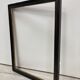 Black and gold frame decorated with Greek frieze decoration