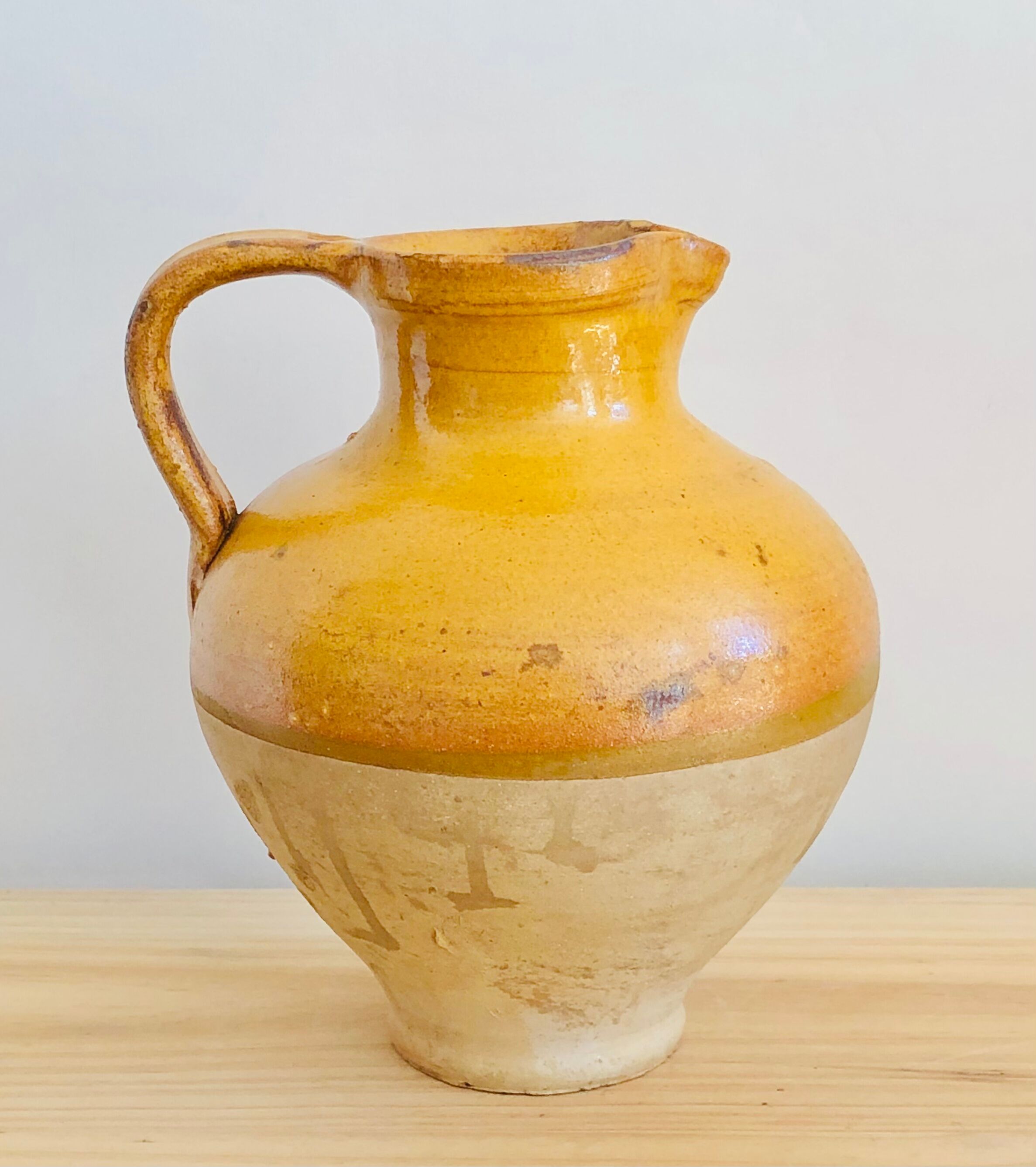Vintage jug in glazed earth